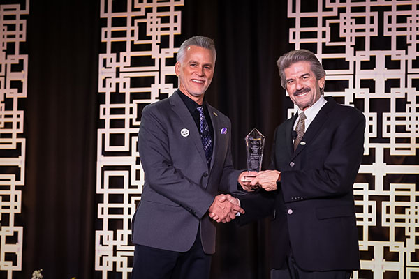 CAPC President Dr. Rick Marrinson (left) presents award to Blagburn (right)